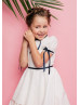 Ivory Cotton Flower Girl Dress With Navy Blue Ribbon